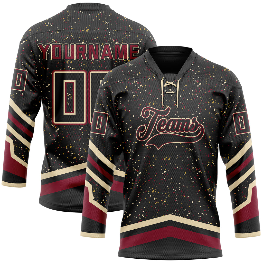 Custom Black Old Gold Cream-Crimson Paint Splatter Stripe Lace Neck Hockey Jersey