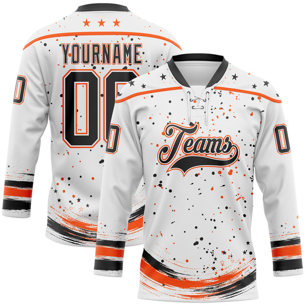 Custom White Black-Orange Stars Paint Splatter Brush Stroke Lace Neck Hockey Jersey